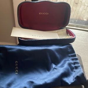 Womens Black and Dark Blue GUCCI shades with red and white strips and Gold GG